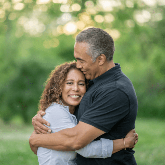 stock photo of a couple facing each other while hugging