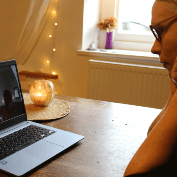 photo of someone watching Funeral Service on Laptop