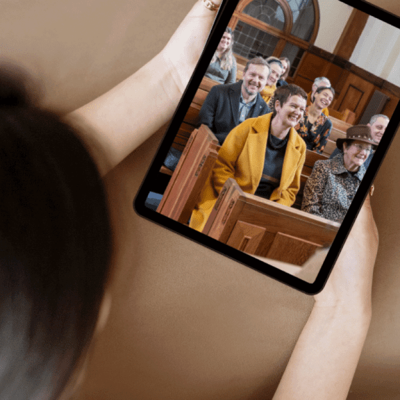 photo of someone watching a Service on Tablet