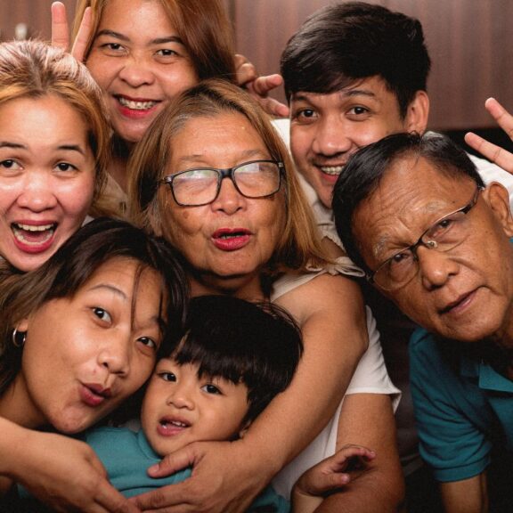 photo of a family of seven people posing for a photo