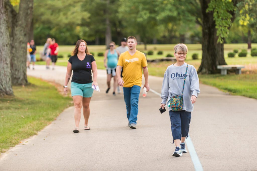 Photo of people walking down a road