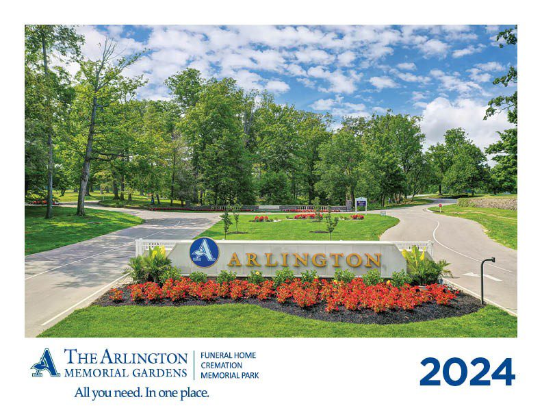 An outdoor photo featuring flowers and trees