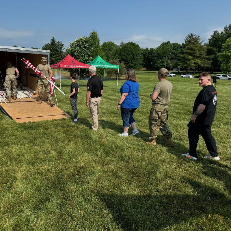 Volunteers waiting in line to get American flags to place in the ground for Memorial Day