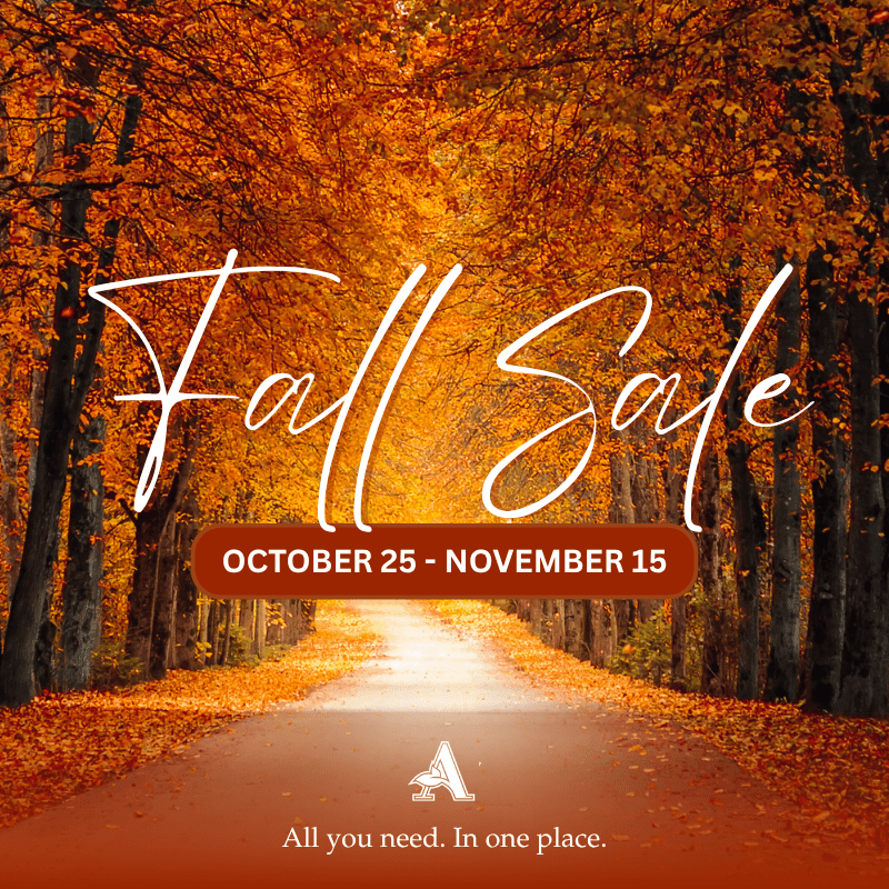 A road covered with orange leaves on the side, surrounded by tall trees with orange leaves, with the text "Fall Sale October 25-November 15" in the middle, with Arlington Memorial Gardens logo at the bottom, and "All you need. In one place." below it.