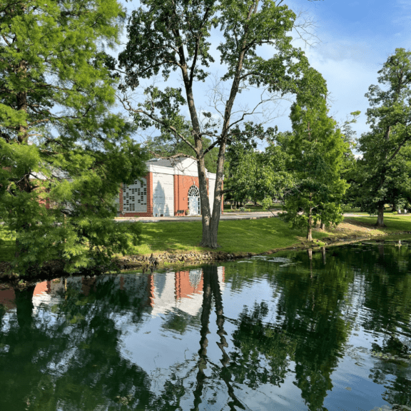 Lake view with trees and memorial building