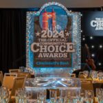 Photo of the stage and dining area at the Community Choice Awards Gala